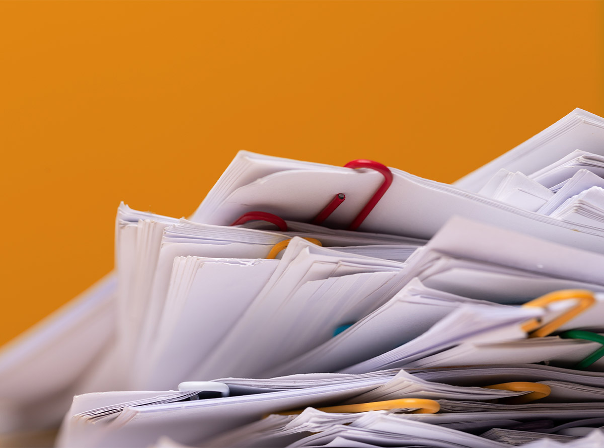 Stack of Group report papers Document on orange background