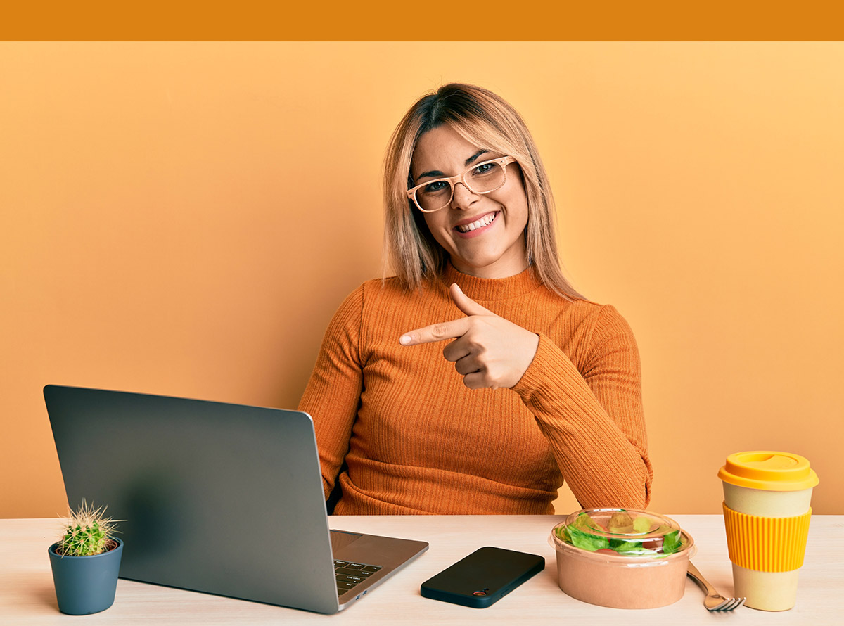 Female student working at the office wearing glasses smiling happy pointing with hand and finger