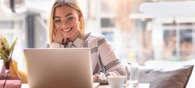 Smiling woman with laptop