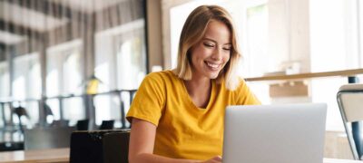 Woman with laptop in café